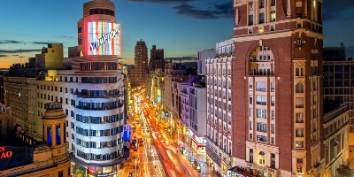 Busy cityscape lit up at night - Contemporary Culture and Society