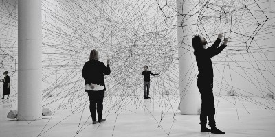 People with spiky, interconnected art installation - Research by Thematic Field