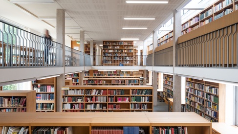 Image of the MMLL library shelves from the second floor, overlooking the void