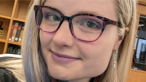 Close-up of woman with blonde hair and glasses
