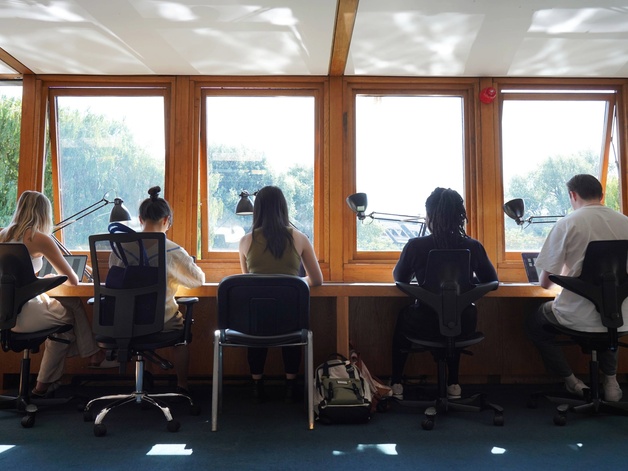 students studying in Darwin College library