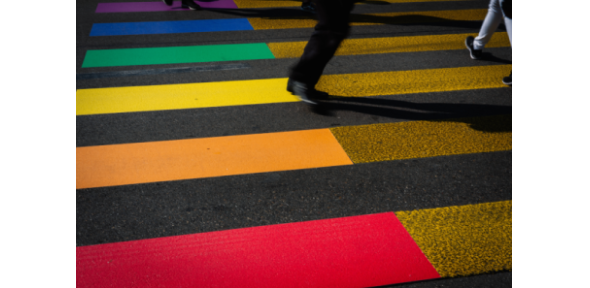Claudio Schwarz Street with rainbow coloured striped crosswalk