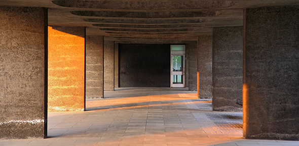 Afternoon sunlight catching pillars underneath the Raised Faculty Building Afternoon sunlight catching pillars underneath the Raised Faculty Building
